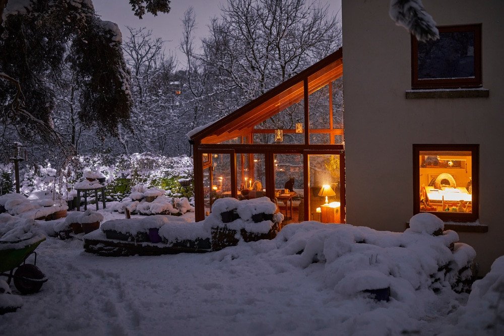 Furnace Inspections. A warm welcome at dusk at the Dales farm cottage in evening snow.