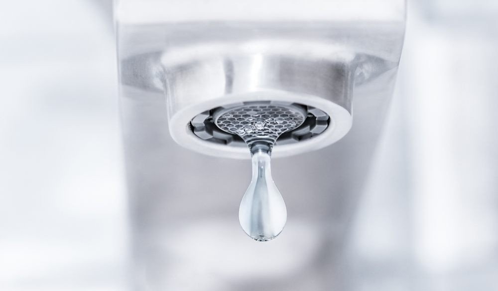 Reduce Water Usage Through Efficient Plumbing Practices. dripping water from a tap. lack or leakage of water.